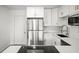 Bright kitchen with stainless steel refrigerator and modern appliances, creating a sleek, functional space at 5045 10Th S Ave, Gulfport, FL 33707