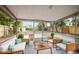 Relaxing screened porch with comfortable seating area and a view of the backyard at 5045 10Th S Ave, Gulfport, FL 33707
