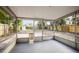 Covered porch with screened walls offering backyard views and additional outdoor living space at 5045 10Th S Ave, Gulfport, FL 33707