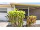 View of screen enclosed lanai from lushly landscaped backyard at 5062 White Oak Ct, Bradenton, FL 34207