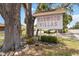 Community sign for Oakwood Villas surrounded by mature trees and landscaping at 5062 White Oak Ct, Bradenton, FL 34207