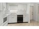 Efficient kitchen featuring white cabinetry, tile floors, and essential appliances for comfortable cooking at 5062 White Oak Ct, Bradenton, FL 34207