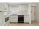 The functional kitchen includes white cabinets, essential appliances, and tile flooring, designed for ease of use at 5062 White Oak Ct, Bradenton, FL 34207