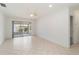 A bright and spacious living room featuring tile flooring and access to the lanai at 5062 White Oak Ct, Bradenton, FL 34207