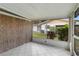 Screened patio with tile flooring offers a pleasant view of the lawn and surrounding greenery for relaxation at 5062 White Oak Ct, Bradenton, FL 34207
