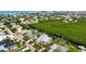 Waterfront property with lush landscaping, a private dock, and convenient access to the open waters at 512 77Th St, Holmes Beach, FL 34217