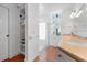 Clean and bright bathroom featuring a glass-enclosed shower and double sink vanity at 512 77Th St, Holmes Beach, FL 34217