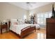 Bright bedroom features a large window with shutters, providing ample natural light and a cozy atmosphere at 512 77Th St, Holmes Beach, FL 34217