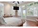 Bright bedroom with a king bed, plantation shutters, and access to a balcony, offering serene views at 512 77Th St, Holmes Beach, FL 34217