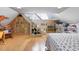 Bonus room has vaulted ceiling, beautiful wood floors, built-in bookshelves, and quirky stairs at 512 77Th St, Holmes Beach, FL 34217