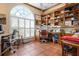 Well-lit home office with custom built-in bookshelves, providing ample storage and workspace at 512 77Th St, Holmes Beach, FL 34217