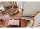 Open-concept living room with a brick fireplace, grand piano, and dining area, perfect for gatherings at 512 77Th St, Holmes Beach, FL 34217