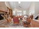 Spacious living room boasts a fireplace, built-in shelving, and french doors to the outside at 512 77Th St, Holmes Beach, FL 34217