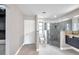 Modern bathroom with a glass shower door, a toilet and a large vanity with dark wood cabinets at 5125 Palm Aire Dr, Sarasota, FL 34243