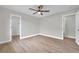 A light and airy bedroom with light wood floors and two doorways at 5125 Palm Aire Dr, Sarasota, FL 34243