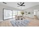 Bright dining area featuring a modern light fixture and sliding doors to the patio at 5125 Palm Aire Dr, Sarasota, FL 34243