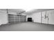 Well-maintained garage featuring an automatic door and storage space at 5125 Palm Aire Dr, Sarasota, FL 34243