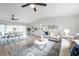 Spacious open-concept living area with a modern ceiling fan and dining area at 5125 Palm Aire Dr, Sarasota, FL 34243
