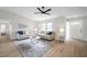 Inviting living room with wood floors, stylish decor, and a bright, airy atmosphere at 5125 Palm Aire Dr, Sarasota, FL 34243