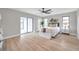 Spacious main bedroom features a sliding glass door to the lanai and is decorated with neutral tones at 5125 Palm Aire Dr, Sarasota, FL 34243