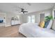 Spacious main bedroom with a ceiling fan, natural light, and access to the outdoor lanai at 5125 Palm Aire Dr, Sarasota, FL 34243