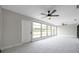 Spacious sunroom featuring large windows with views of the outdoors and bright tile flooring at 5125 Palm Aire Dr, Sarasota, FL 34243