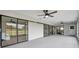 Light-filled sunroom with expansive windows and sliding glass doors, perfect for indoor-outdoor living at 5125 Palm Aire Dr, Sarasota, FL 34243