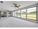 Bright sunroom featuring large windows showcasing the outdoor view and tile flooring at 5125 Palm Aire Dr, Sarasota, FL 34243