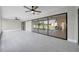Open-concept sunroom with sleek tile flooring, seamlessly connecting to the dining area at 5125 Palm Aire Dr, Sarasota, FL 34243
