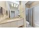 Bathroom features granite counters, large mirror and an adjacent shower and toilet at 5205 88Th E St, Bradenton, FL 34211