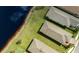 Birds-eye view of home near a pond highlighting backyard space and proximity to neighboring houses at 5358 Shell Mound Cir, Punta Gorda, FL 33982