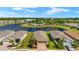 Aerial view of the community showcasing the home's location near a tranquil lake and community amenities at 5358 Shell Mound Cir, Punta Gorda, FL 33982