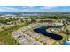 Wide aerial shot featuring the residential community, lake, and bridge spanning the river beyond the neighborhood at 5358 Shell Mound Cir, Punta Gorda, FL 33982
