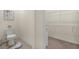 Bathroom with tile flooring plus a toilet and a shelving rack at 5358 Shell Mound Cir, Punta Gorda, FL 33982