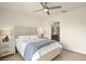 Bright bedroom showcasing a comfortable bed, side tables with lamps, and a ceiling fan at 5358 Shell Mound Cir, Punta Gorda, FL 33982