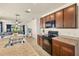 Open kitchen with stainless steel appliances, plenty of cabinet space, and seamless flow into the living area at 5358 Shell Mound Cir, Punta Gorda, FL 33982