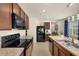 Well-equipped kitchen featuring stainless steel appliances, ample counter space, and wood cabinetry at 5358 Shell Mound Cir, Punta Gorda, FL 33982