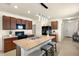 Modern kitchen features a large island, sleek black appliances, and ample cabinet space at 5358 Shell Mound Cir, Punta Gorda, FL 33982