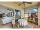 Comfortable screened patio with an outdoor dining table and relaxing view of the living room and pond at 5358 Shell Mound Cir, Punta Gorda, FL 33982