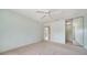 Bright bedroom, with mirrored closet, carpeted floor, and light blue walls at 5566 Avellino Pl, Sarasota, FL 34238