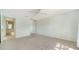 Bedroom featuring a mirrored closet, carpet floors, and natural light from a window at 5566 Avellino Pl, Sarasota, FL 34238