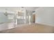 Open-concept living space, with views of the kitchen and bright natural lighting at 5566 Avellino Pl, Sarasota, FL 34238