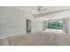 Spacious living room boasts neutral carpet, recessed lighting and access to the lanai and other rooms at 5566 Avellino Pl, Sarasota, FL 34238