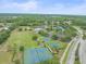 Aerial view of community amenities, including sports fields, a pool, a pond, and recreation areas at 5618 Sheer Bliss Loop, Land O Lakes, FL 34639