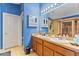 Main bathroom with double sink vanity, walk-in closet access, walk-in shower, and separate sauna at 5618 Sheer Bliss Loop, Land O Lakes, FL 34639