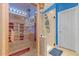 Bathroom featuring an indoor sauna, a shower, and stylish fixtures with ample lighting overhead at 5618 Sheer Bliss Loop, Land O Lakes, FL 34639