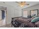 Cozy bedroom featuring a closet, wood floors, and a ceiling fan at 5618 Sheer Bliss Loop, Land O Lakes, FL 34639