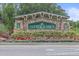 DuPree Lakes community sign featuring stone accents, manicured landscaping, and a welcoming entrance at 5618 Sheer Bliss Loop, Land O Lakes, FL 34639