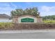 Magnolia Grove at Dupree Lakes community sign featuring stone accents and lush landscaping at 5618 Sheer Bliss Loop, Land O Lakes, FL 34639