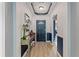 Elegant entryway with hardwood floors, modern console table, and stylish decor at 5618 Sheer Bliss Loop, Land O Lakes, FL 34639